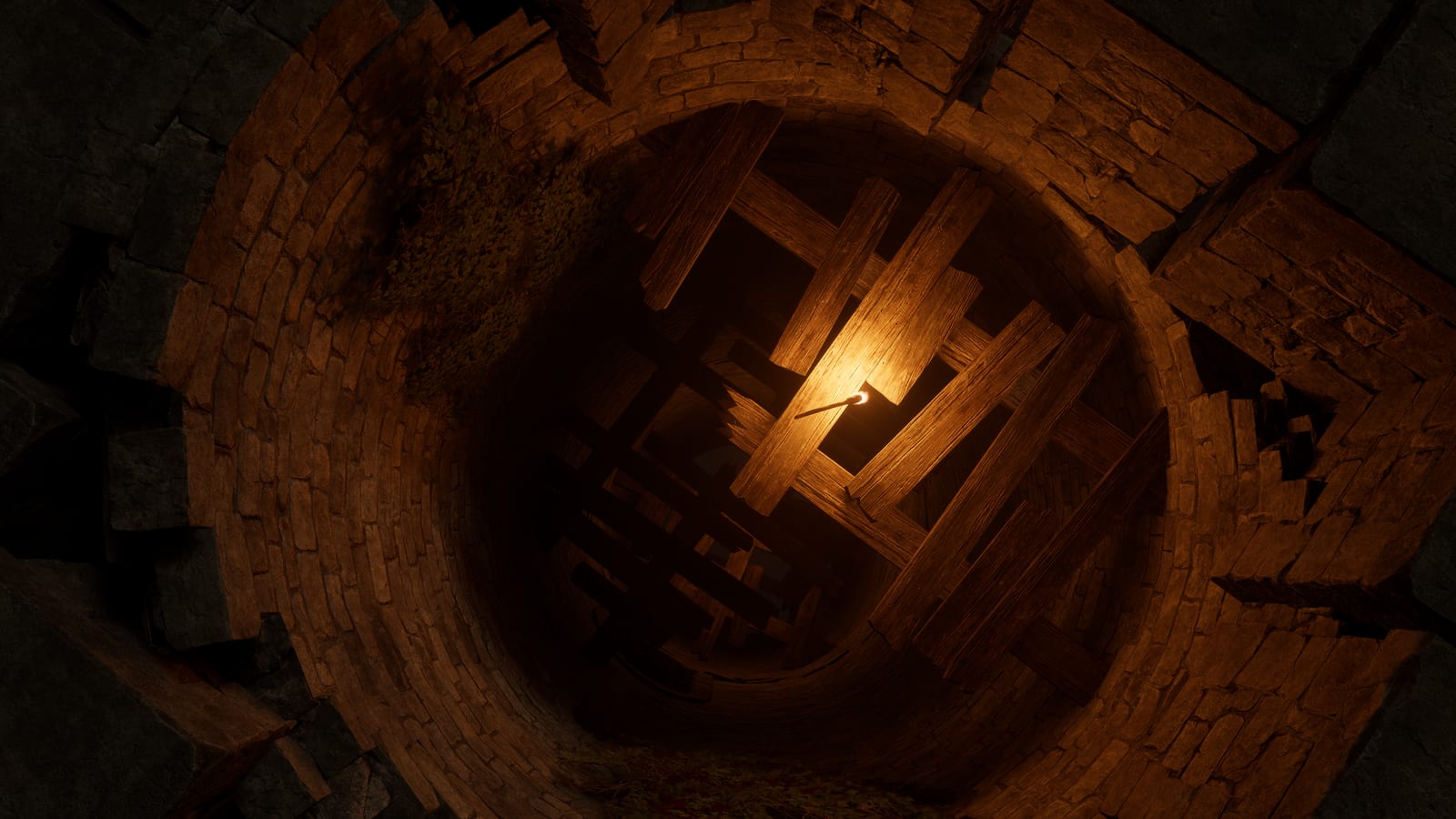 Looking down a stone shaft, timber scaffolding dropping away into the dark with a single lantern lit far below.